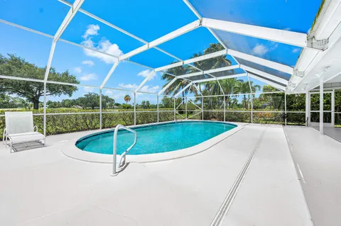 a view of a swimming pools under an umbrella
