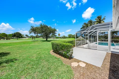 a view of a house with a backyard porch and sitting area