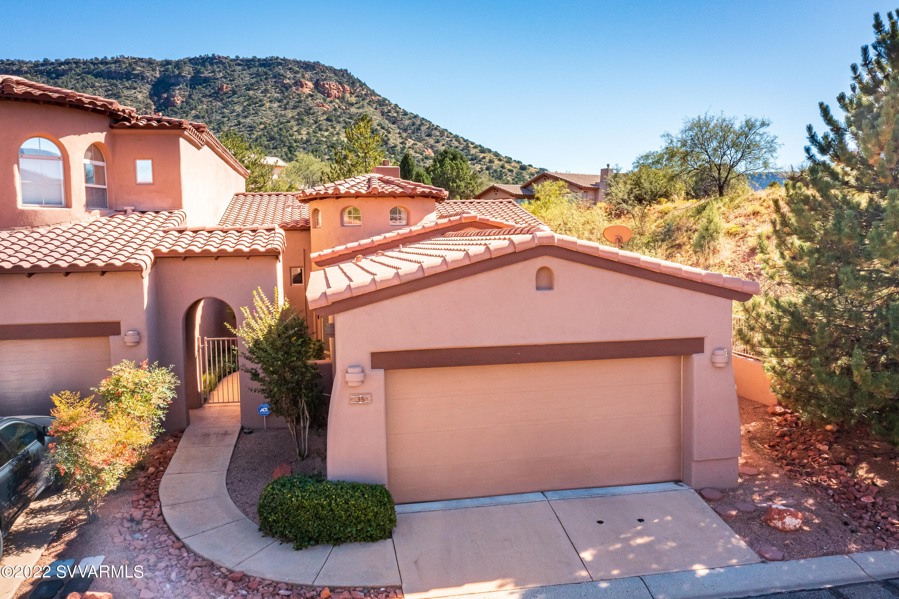 35 Rio Sinagua Sedona, AZ 86351 - Photo 1 of 67 a front view of a house with garden