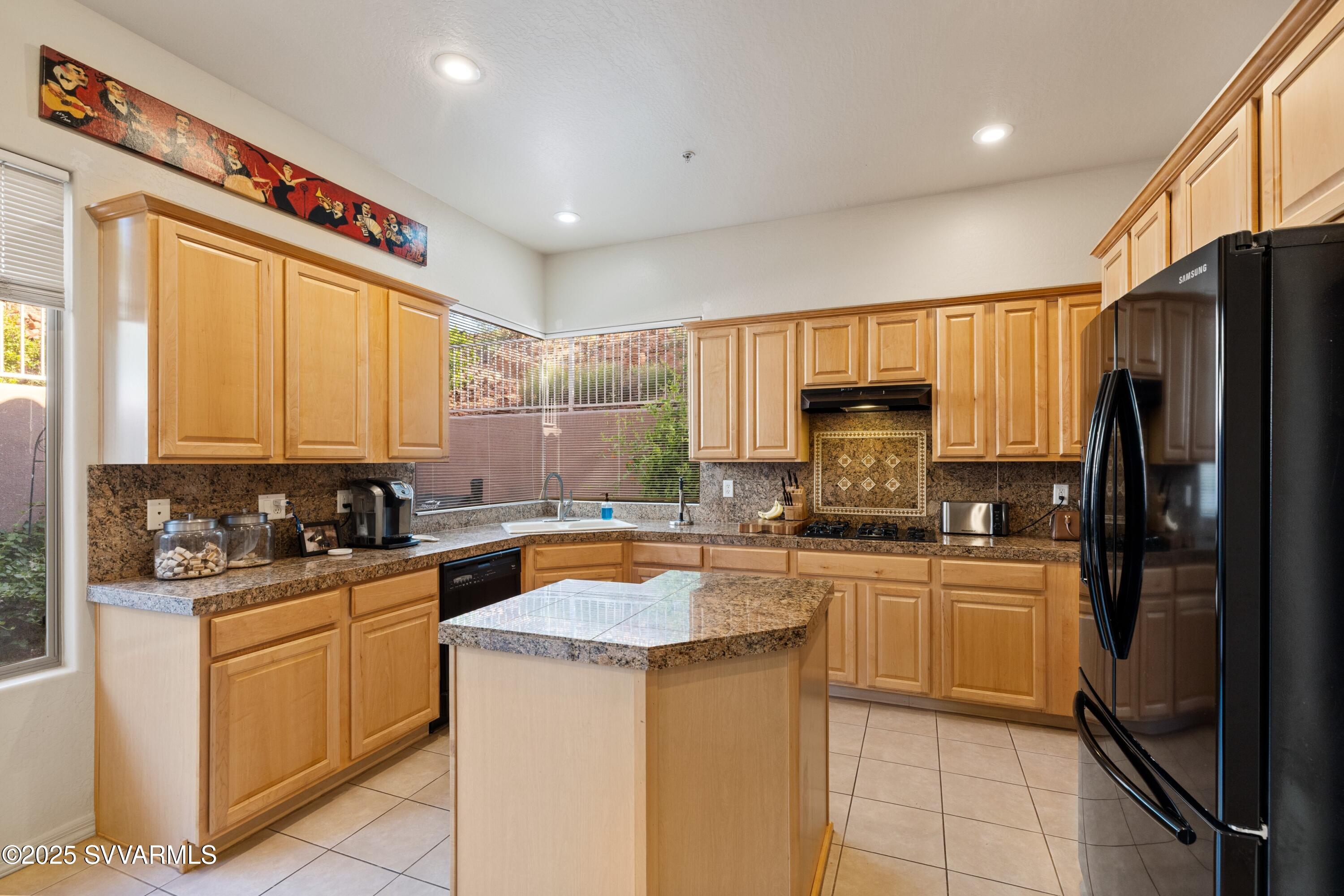 35 Rio Sinagua Sedona, AZ 86351 - Photo 13 of 67 a kitchen with a sink a stove cabinets and refrigerator