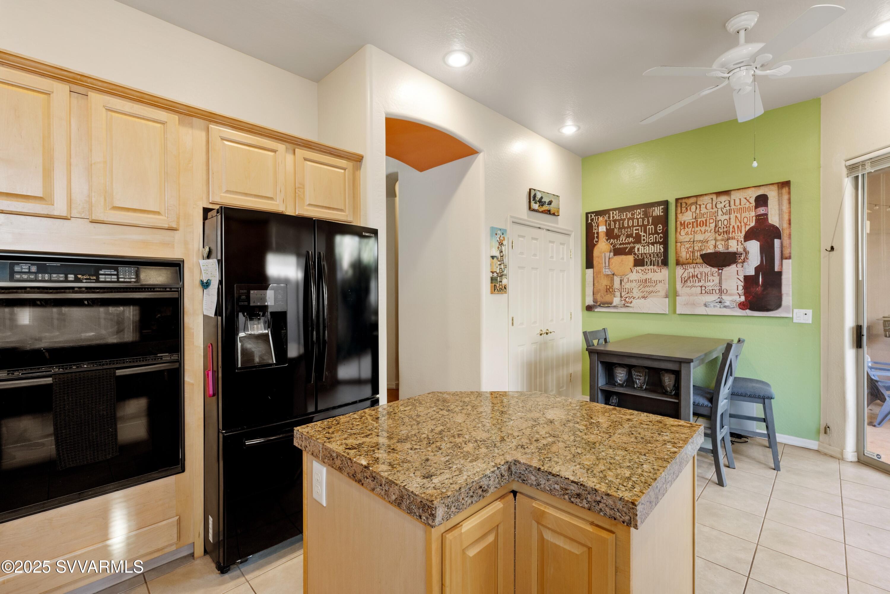 35 Rio Sinagua Sedona, AZ 86351 - Photo 16 of 67 a kitchen with stainless steel appliances granite countertop a stove and a refrigerator