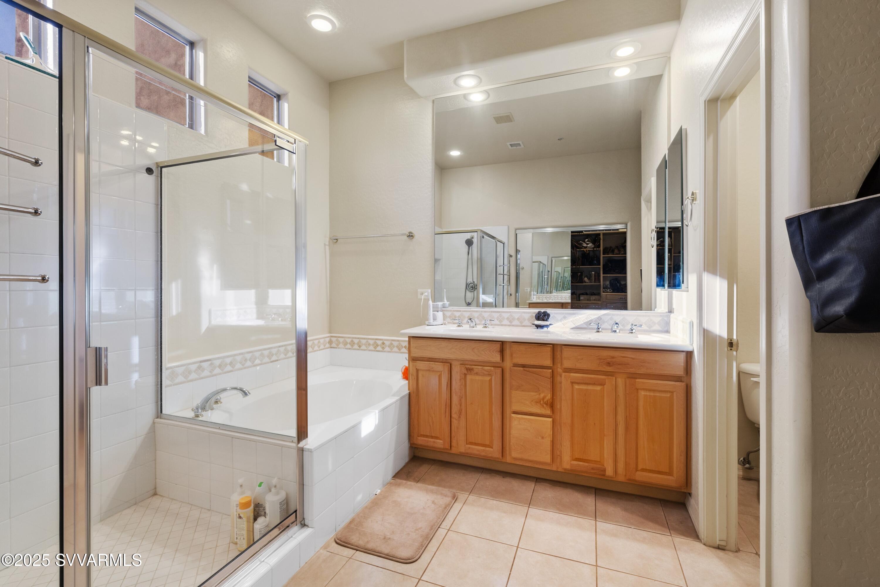 35 Rio Sinagua Sedona, AZ 86351 - Photo 24 of 67 a bathroom with a tub sink shower and mirror