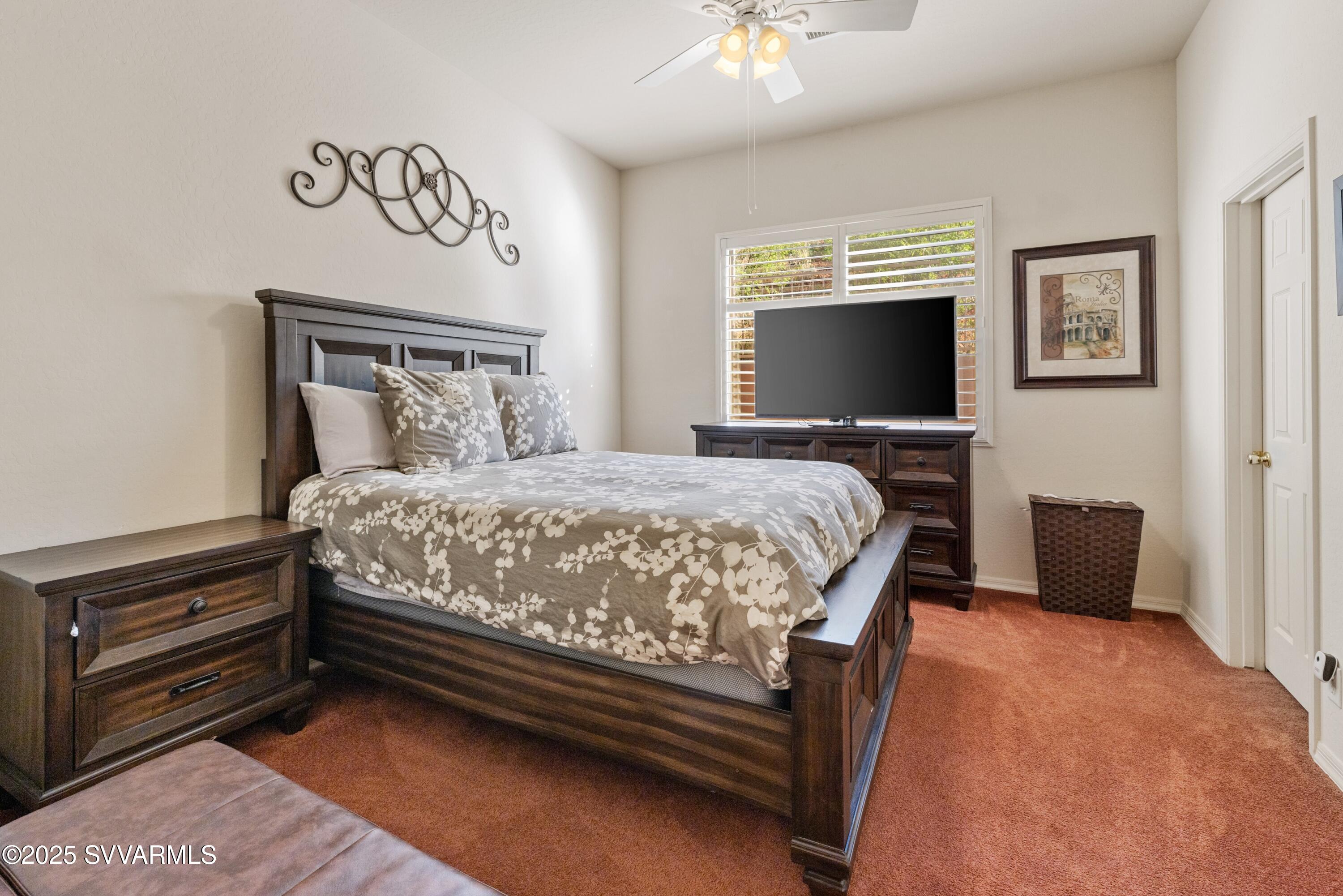 35 Rio Sinagua Sedona, AZ 86351 - Photo 30 of 67 a bedroom with a bed and a flat screen tv