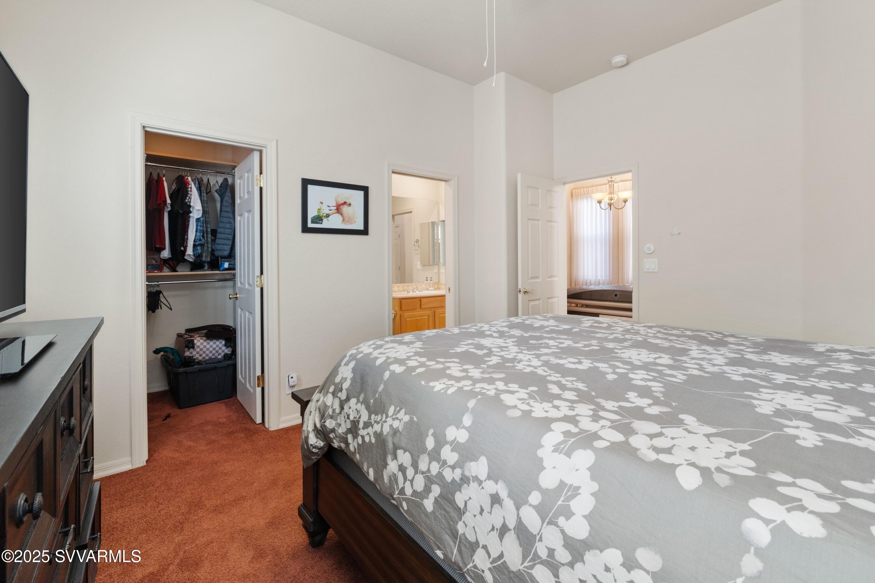 35 Rio Sinagua Sedona, AZ 86351 - Photo 31 of 67 a bedroom with a bed and a cabinets