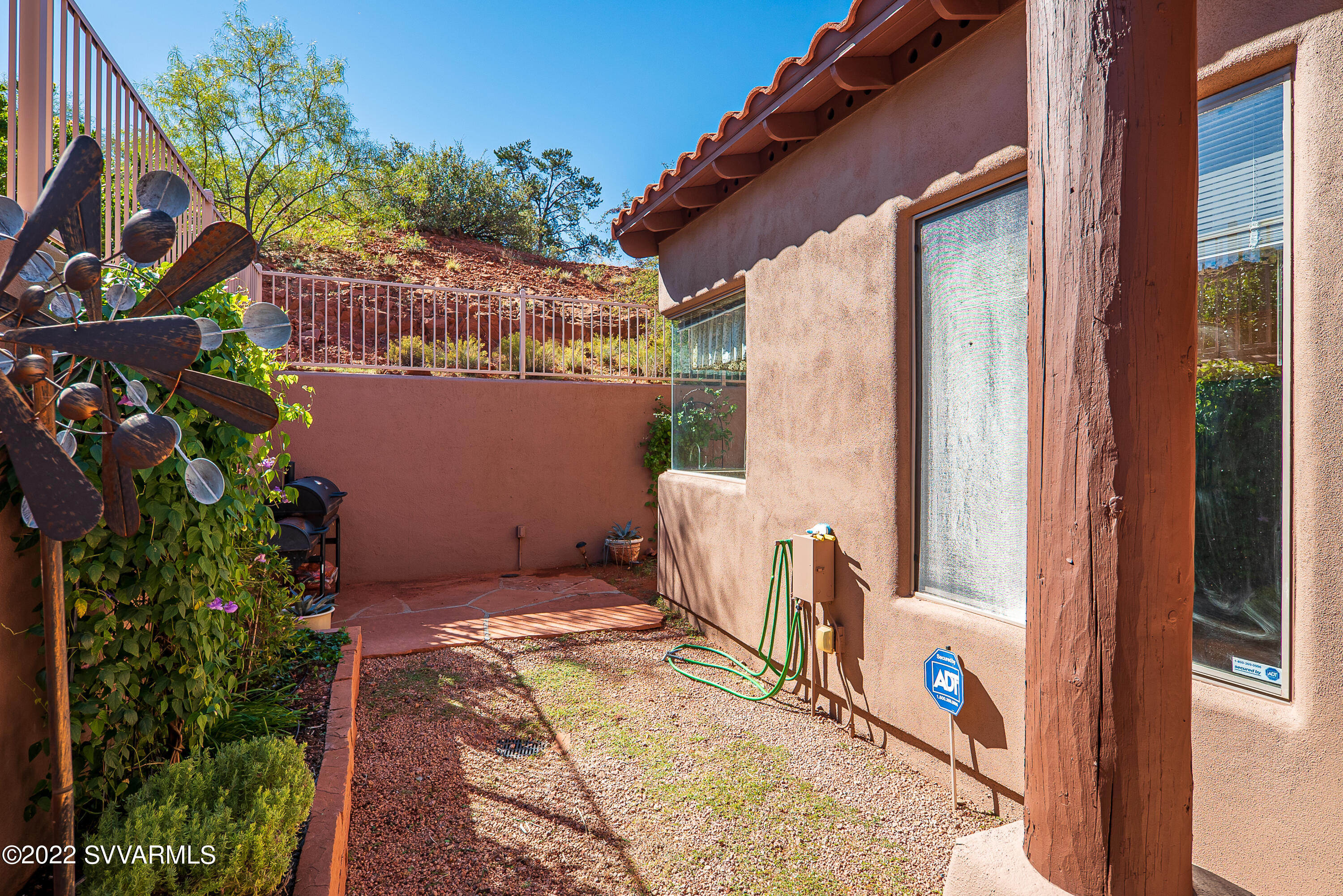 35 Rio Sinagua Sedona, AZ 86351 - Photo 40 of 67 a view of a backyard with plants and a patio