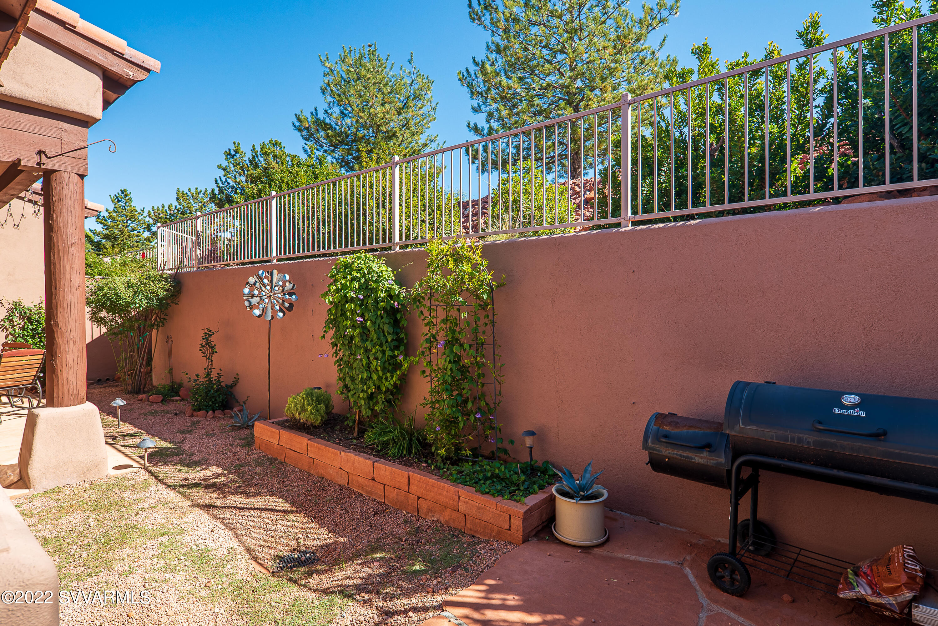 35 Rio Sinagua Sedona, AZ 86351 - Photo 42 of 67 a backyard of a house with lots of green space and fountain