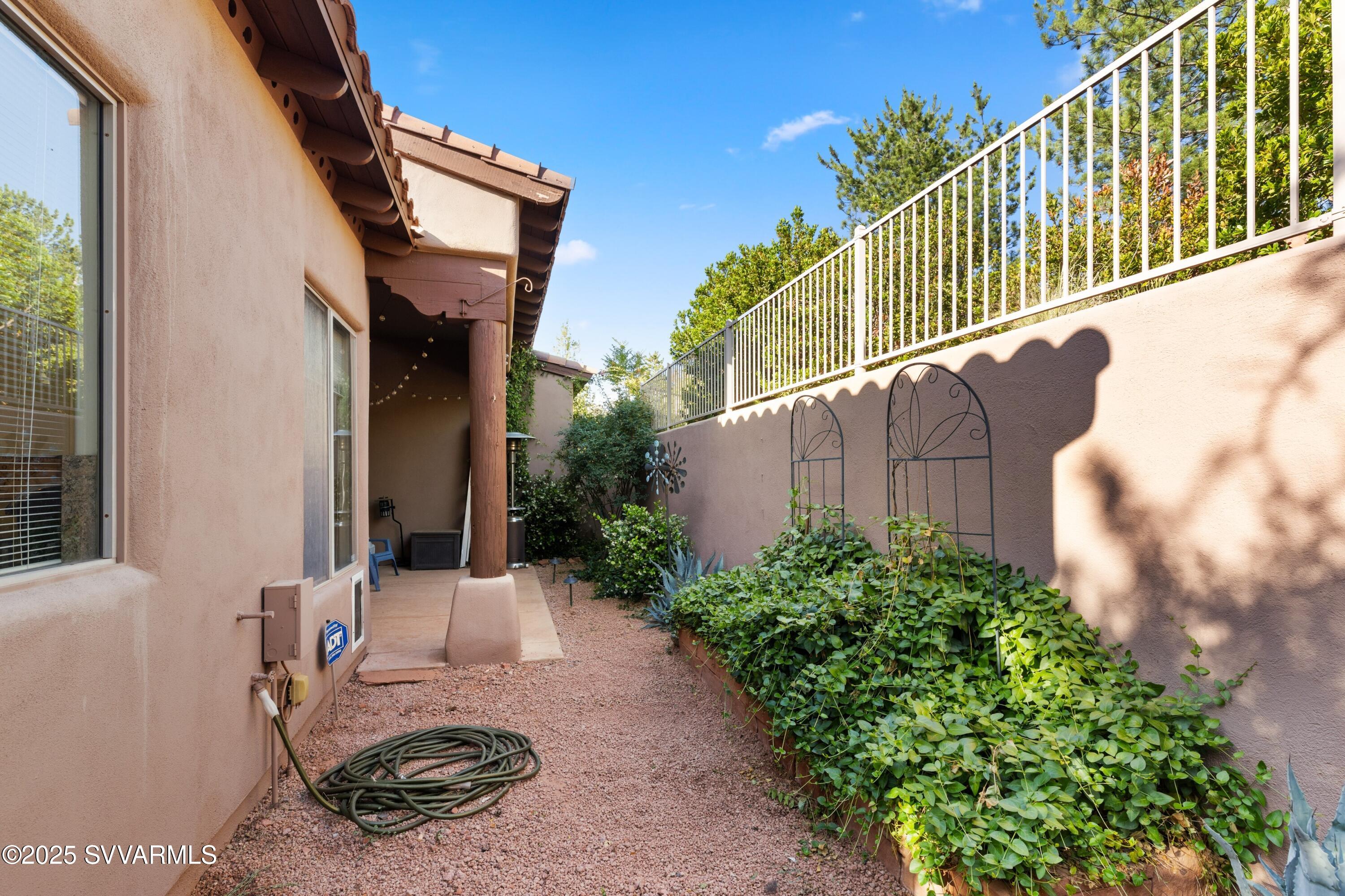 35 Rio Sinagua Sedona, AZ 86351 - Photo 43 of 67 a view of a house with a small yard and potted plants
