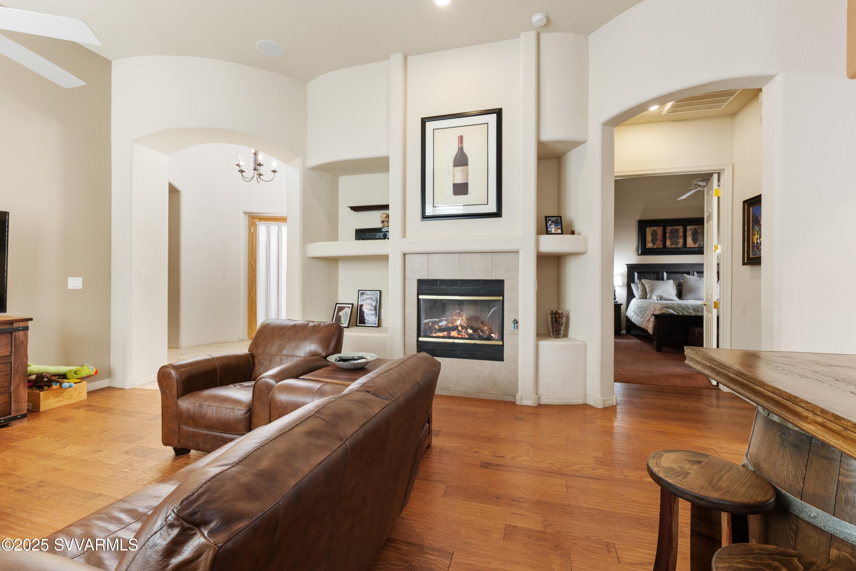 35 Rio Sinagua Sedona, AZ 86351 - Photo 8 of 67 a living room with furniture and a fireplace
