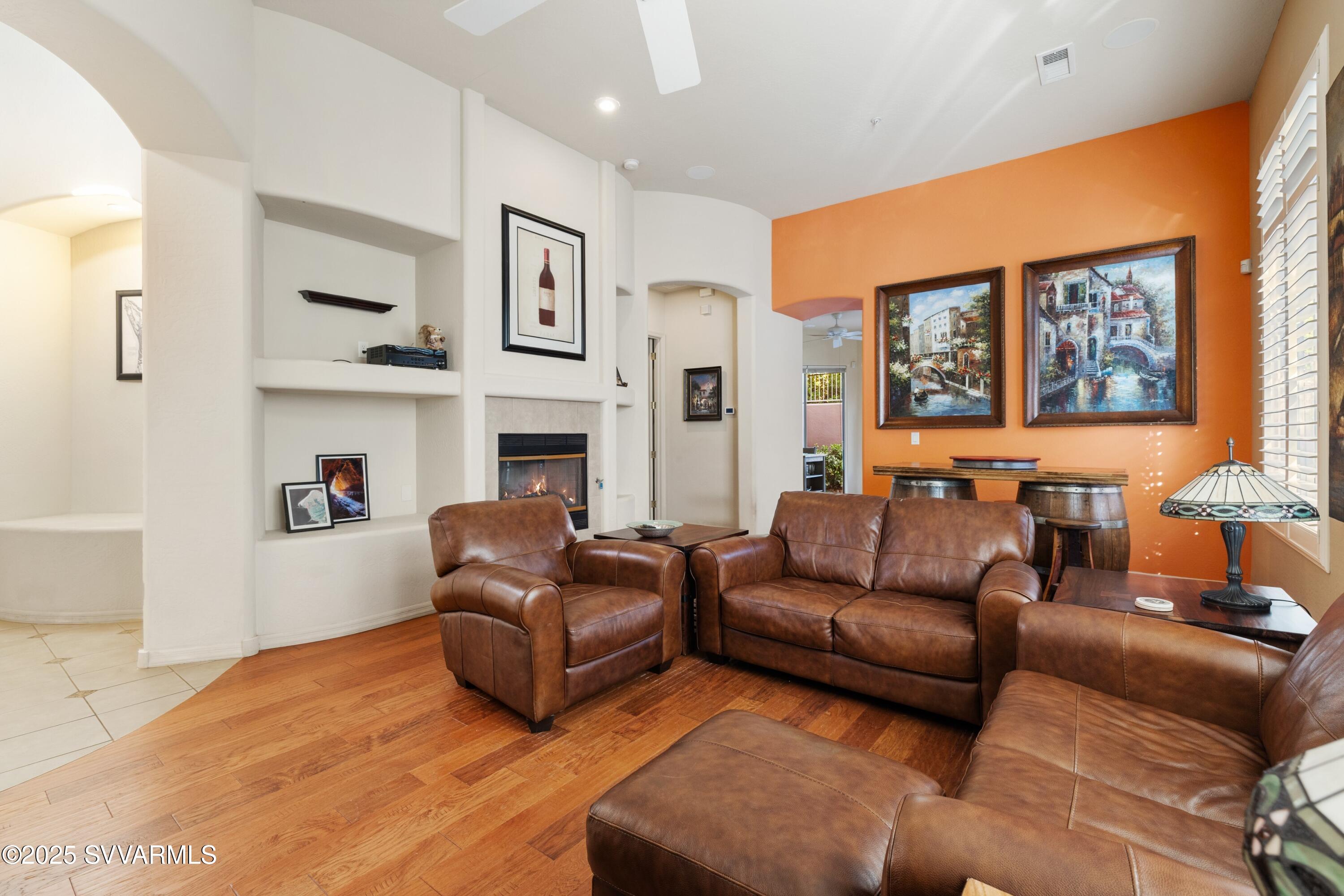 35 Rio Sinagua Sedona, AZ 86351 - Photo 10 of 67 a living room with furniture window and a fireplace