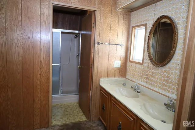 a bathroom with a glass shower door