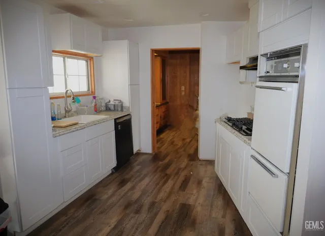 a living room with a bed and furniture