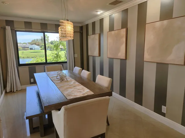 a view of a dining room with furniture window and outside view