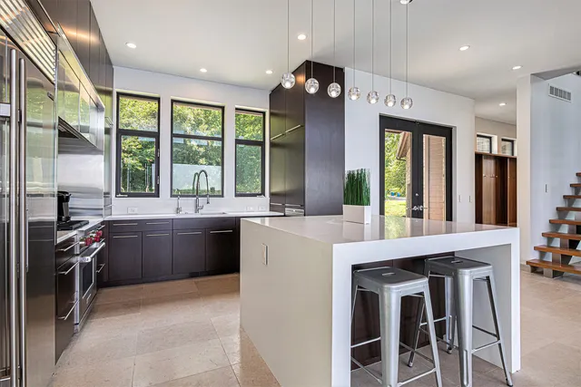 a view of an entryway with wooden floor and windows