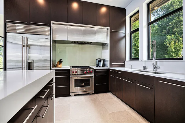 a living room with a bed furniture and a flat screen tv