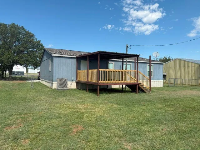a view of backyard with trampoline
