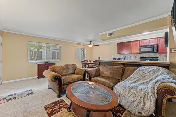 a living room with furniture and a window