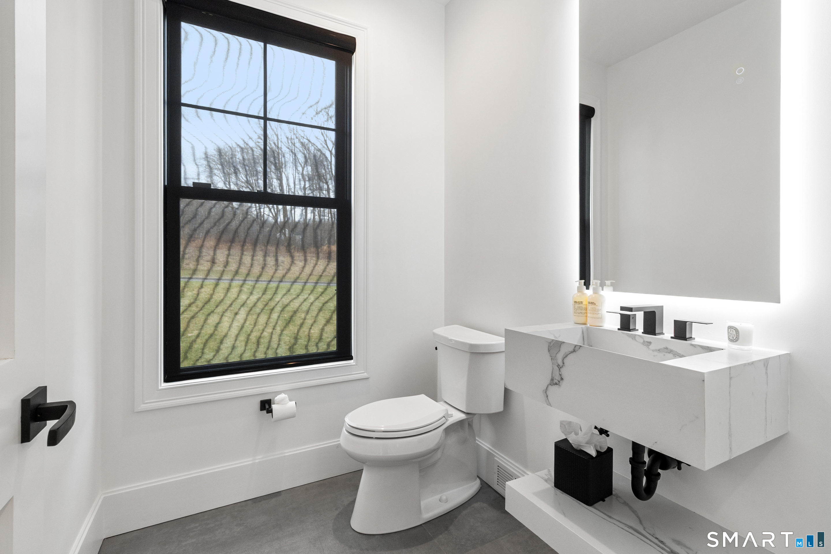 8 Holly Lane Newtown, CT 06482 - Photo 12 of 36 a bathroom with a toilet sink a window and mirror