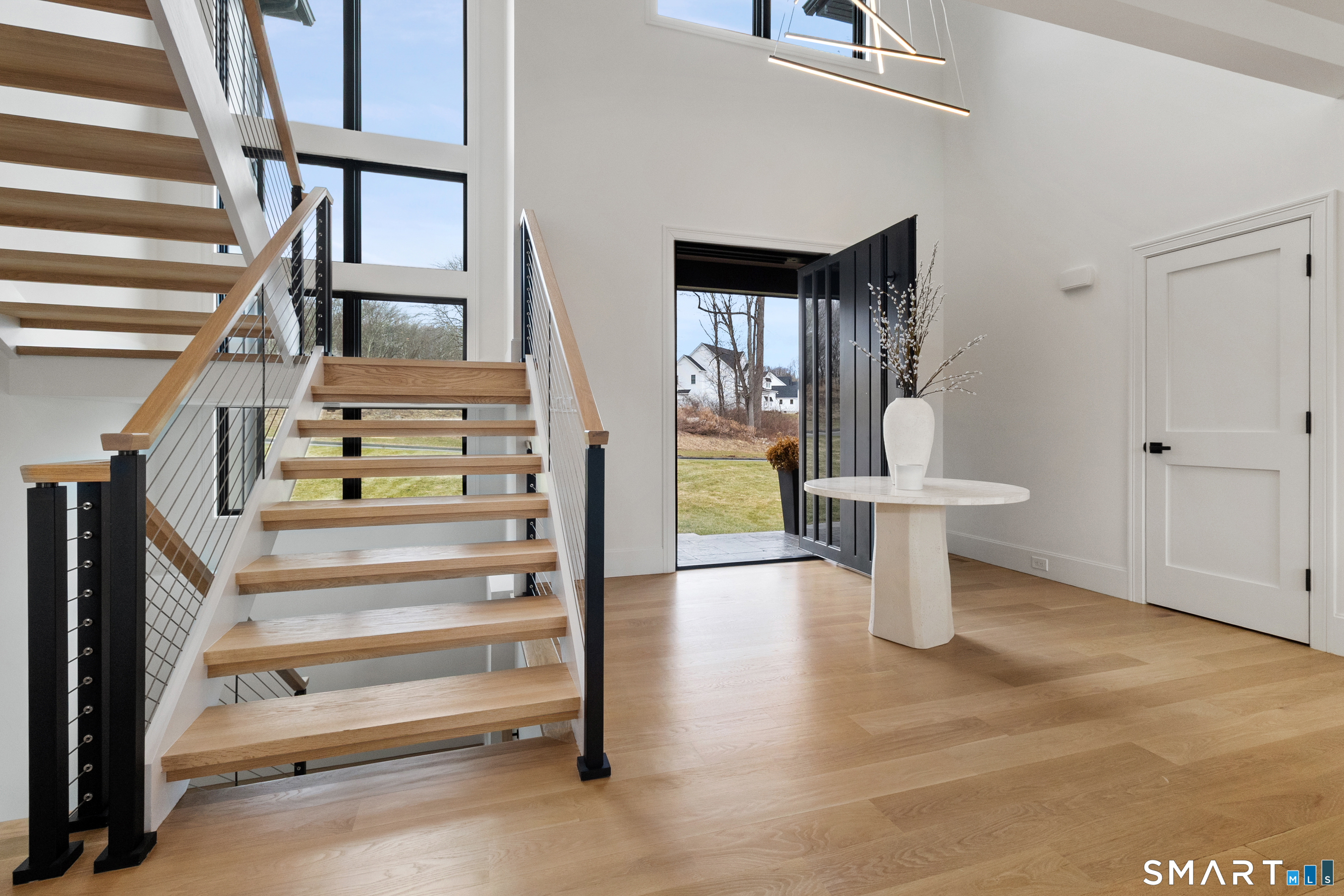 8 Holly Lane Newtown, CT 06482 - Photo 15 of 36 a view of staircase with white walls and windows