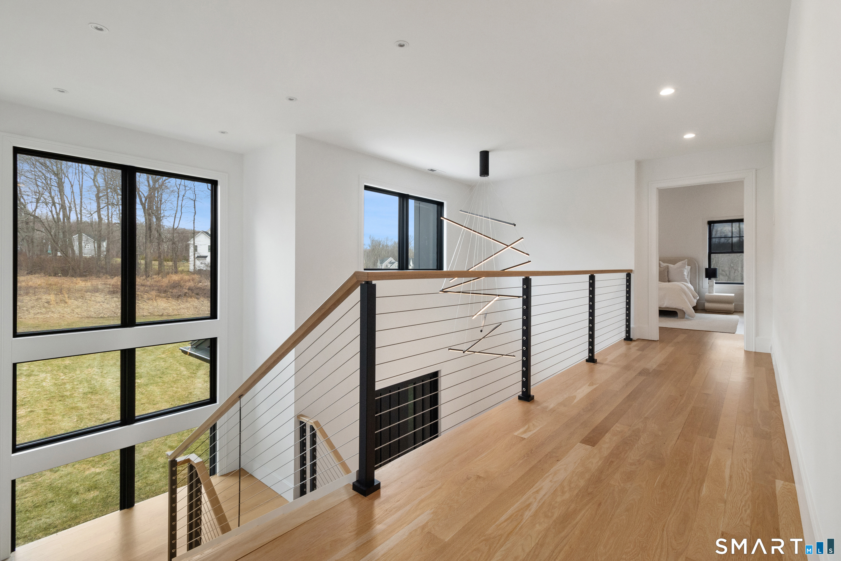 8 Holly Lane Newtown, CT 06482 - Photo 17 of 36 a view of staircase with wooden floor and a window