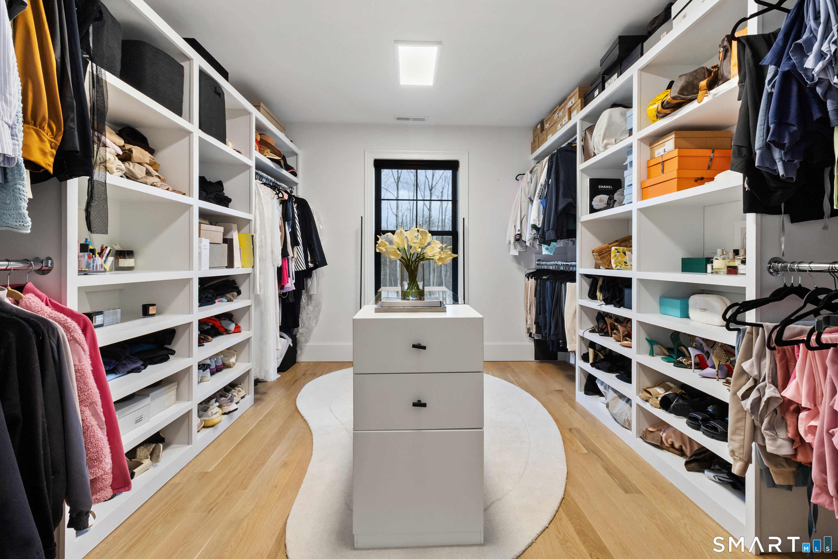 8 Holly Lane Newtown, CT 06482 - Photo 20 of 36 a view of walk in closet with clothes and shoes
