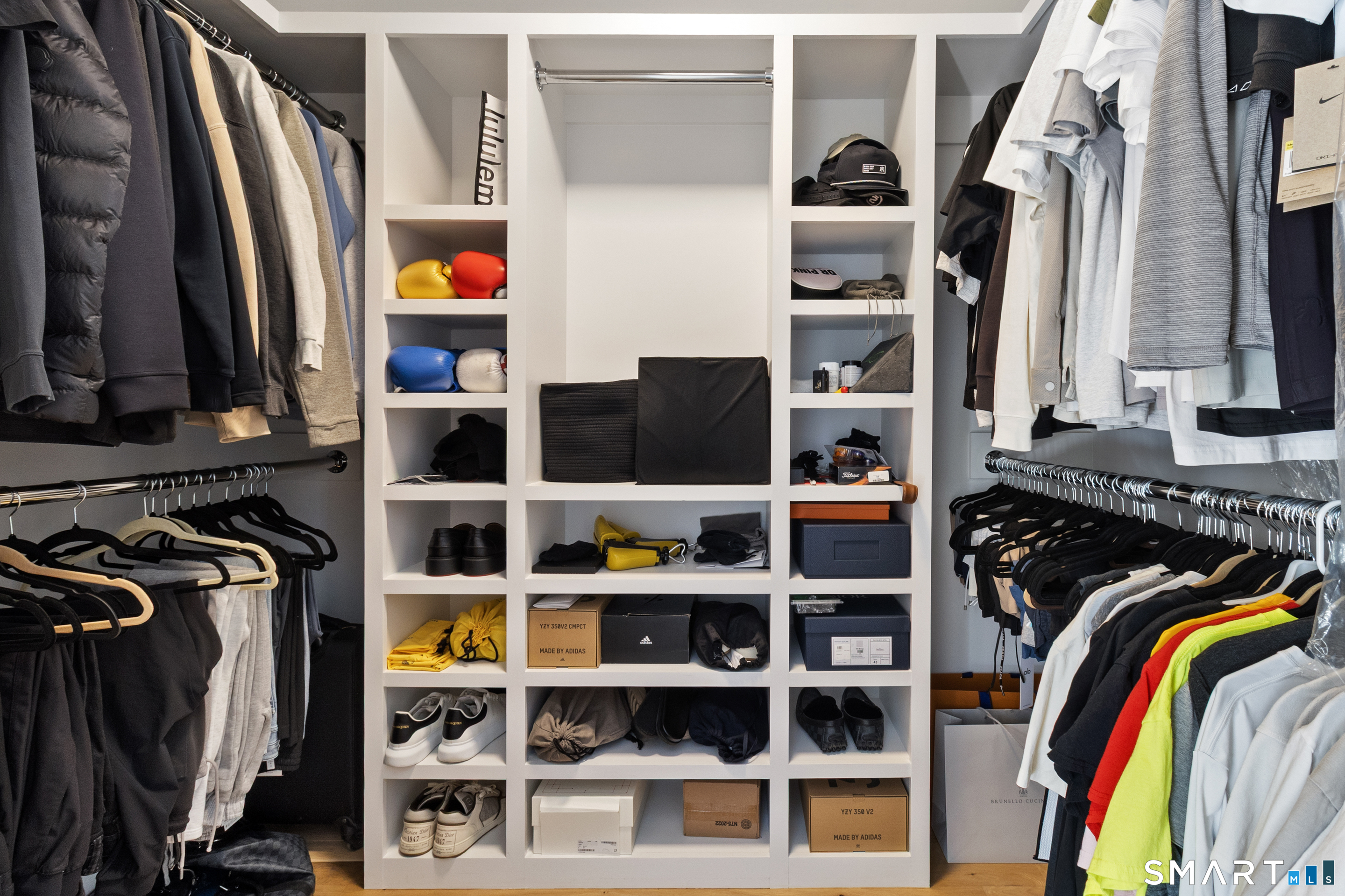 8 Holly Lane Newtown, CT 06482 - Photo 21 of 36 a view of walk in closet with clothes and shoes