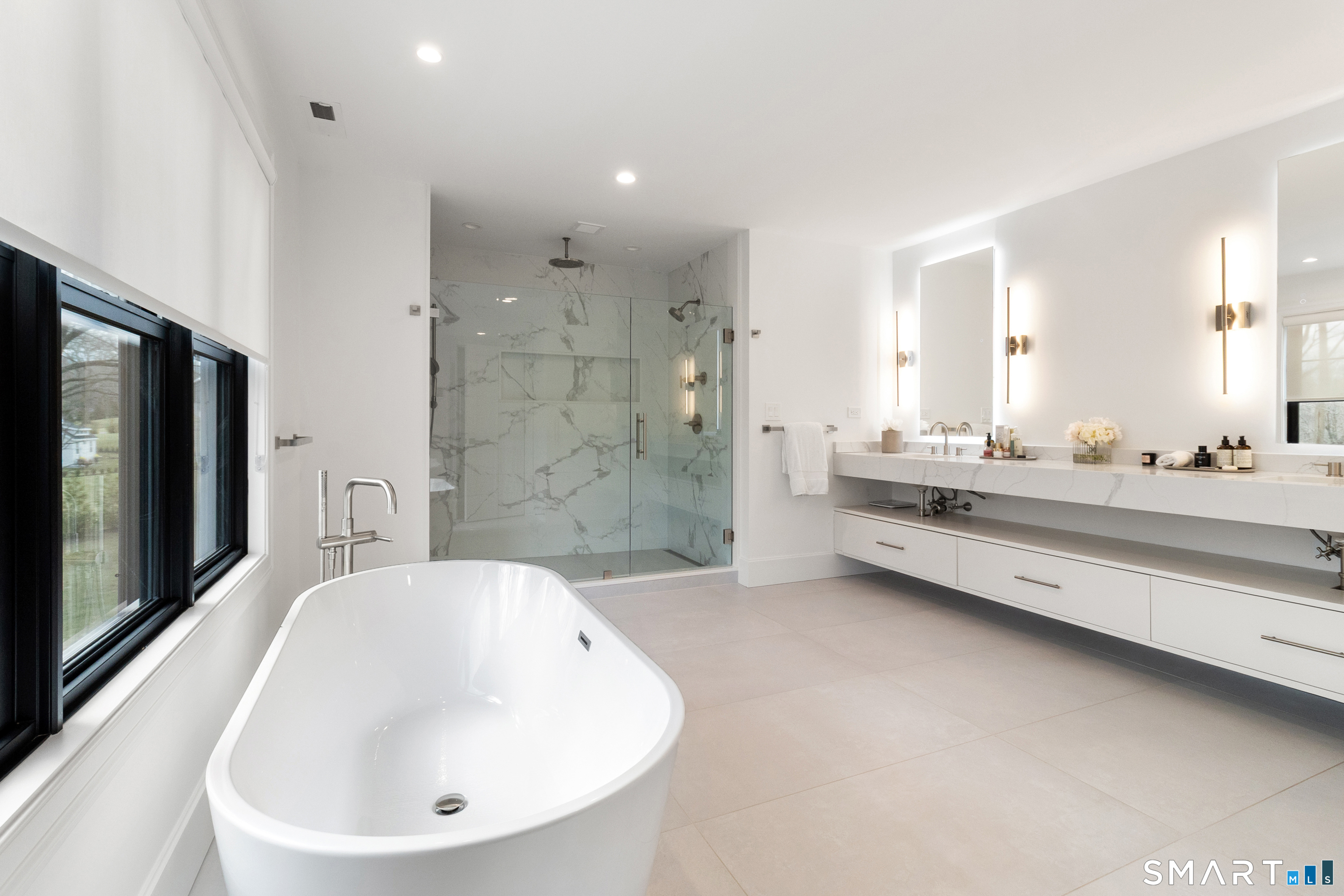 8 Holly Lane Newtown, CT 06482 - Photo 22 of 36 a bathroom with a double vanity sink mirror and bathtub