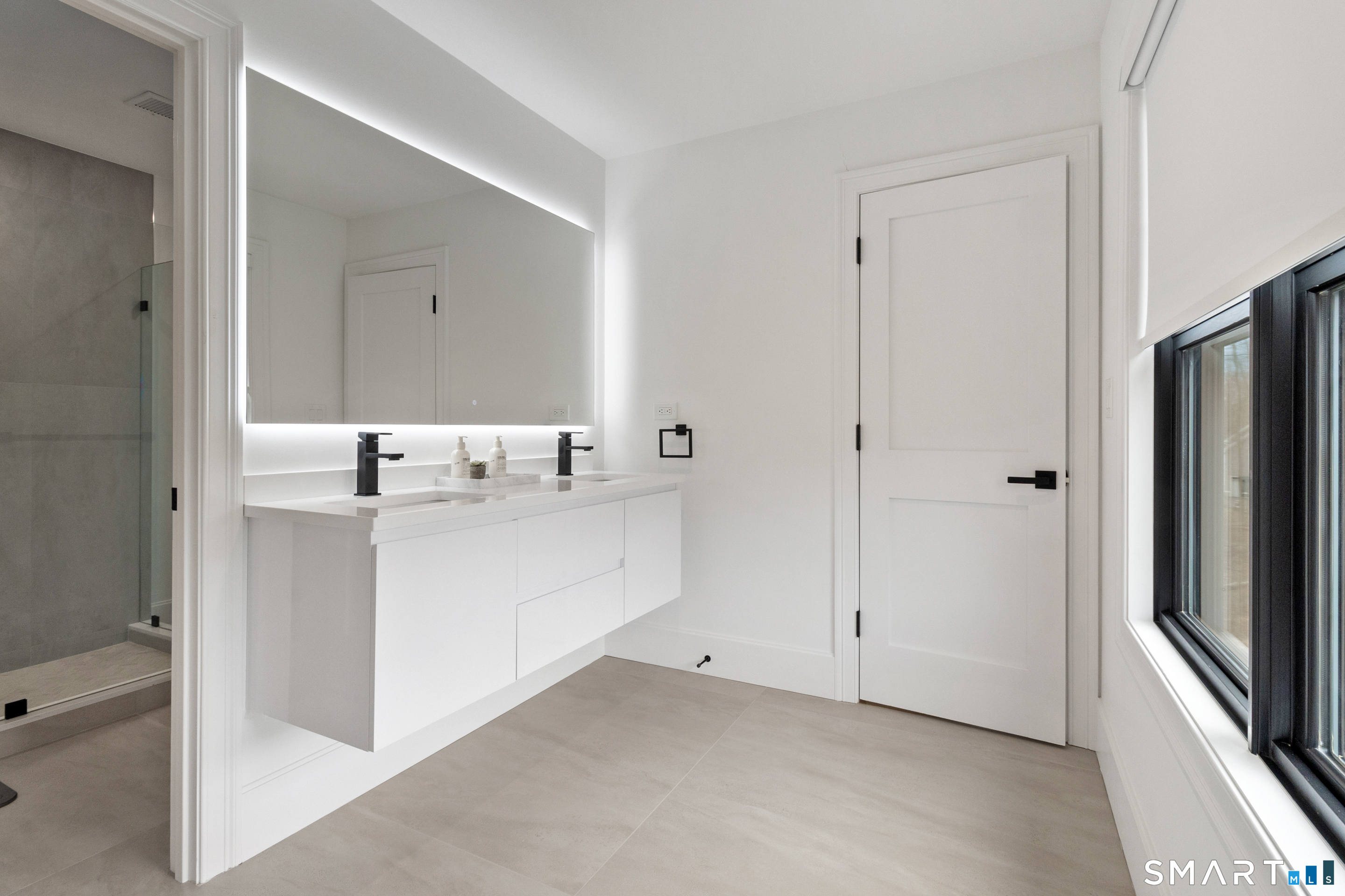 8 Holly Lane Newtown, CT 06482 - Photo 25 of 36 a bathroom with a sink and a mirror