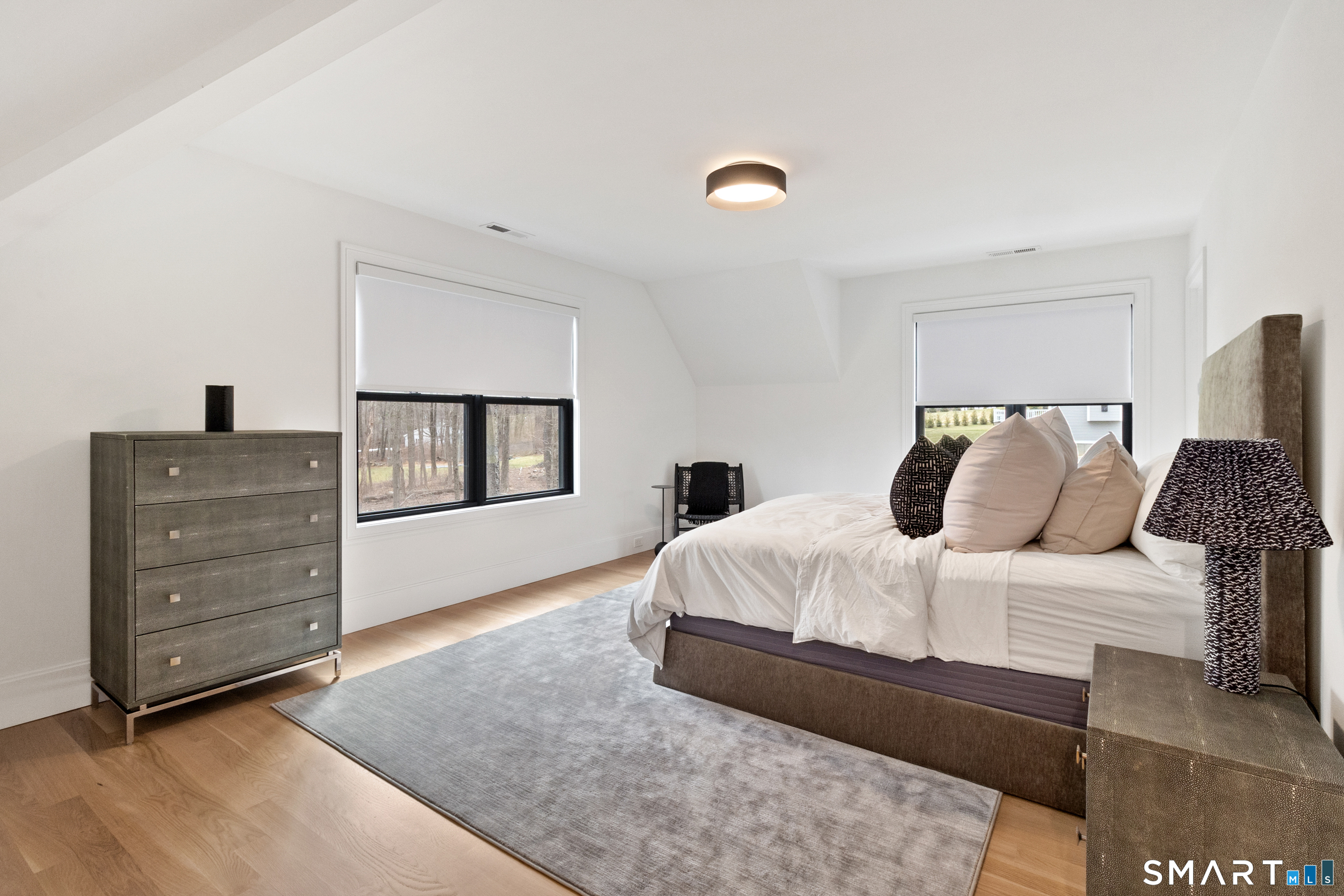 8 Holly Lane Newtown, CT 06482 - Photo 26 of 36 a bedroom with a bed and cabinet