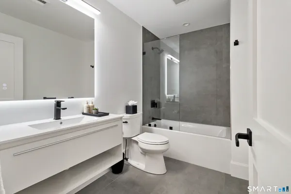 a utility room with sink dryer and washer