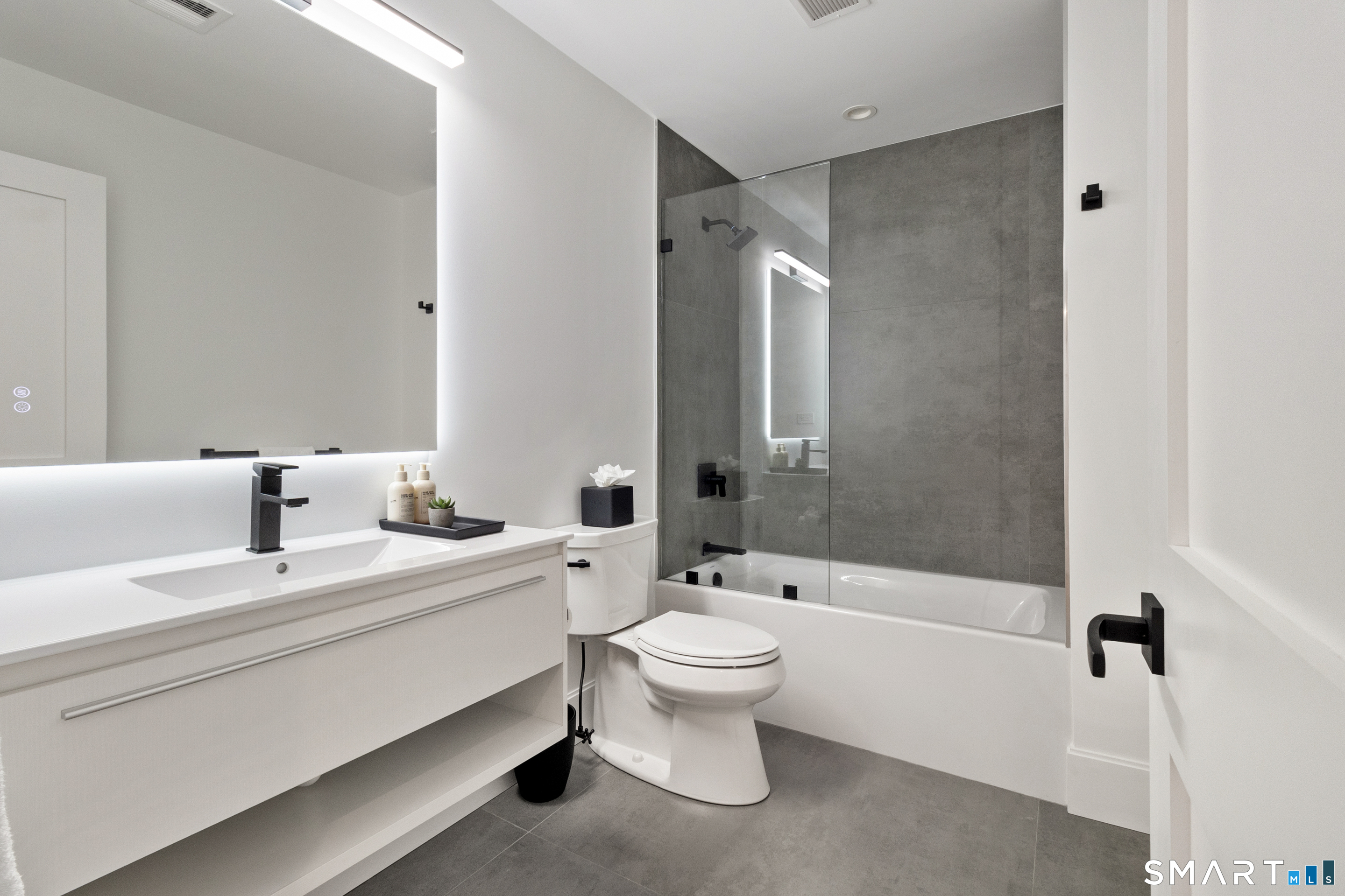 8 Holly Lane Newtown, CT 06482 - Photo 27 of 36 a bathroom with a double vanity sink toilet mirror and shower