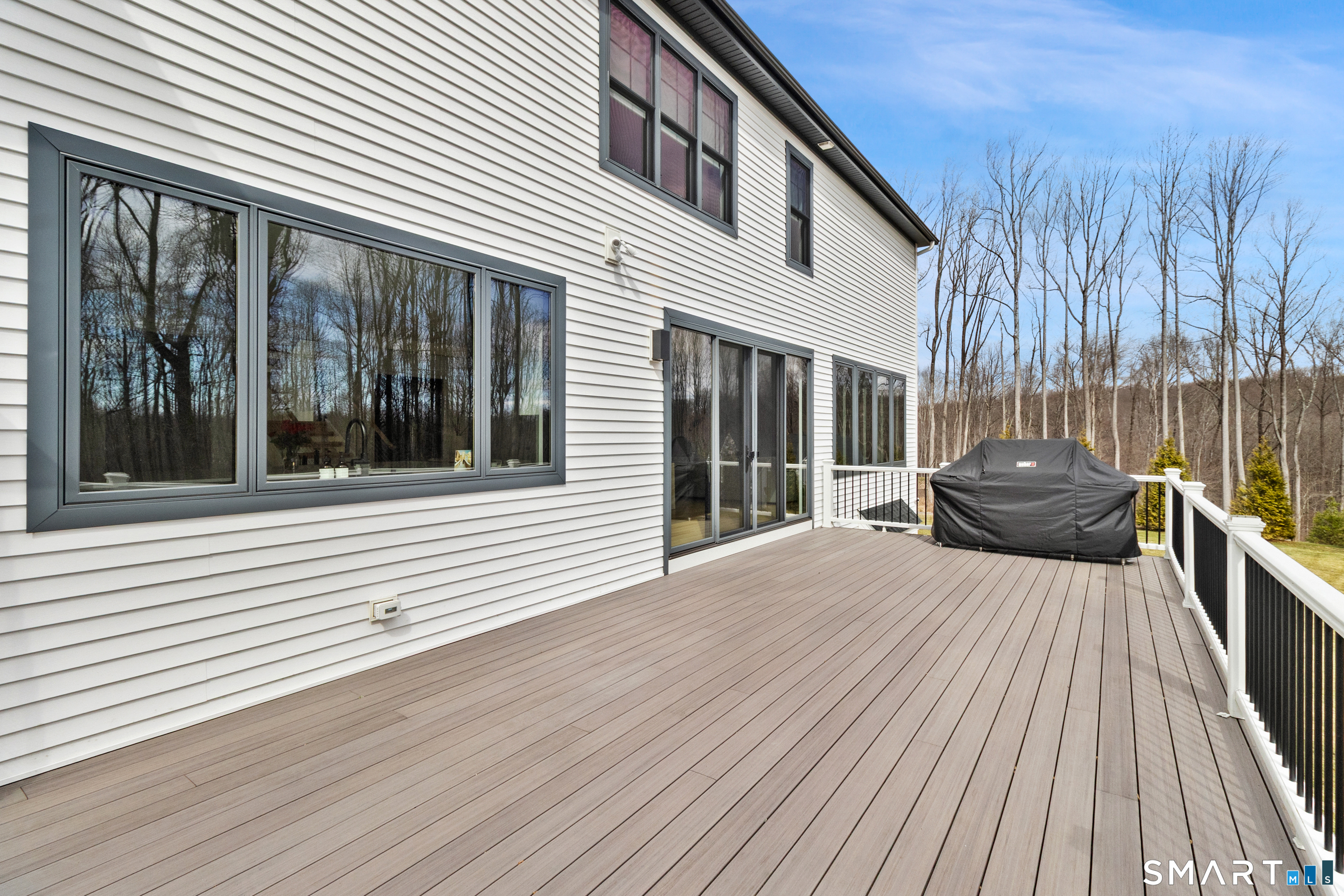 8 Holly Lane Newtown, CT 06482 - Photo 29 of 36 a front view of a house with a yard