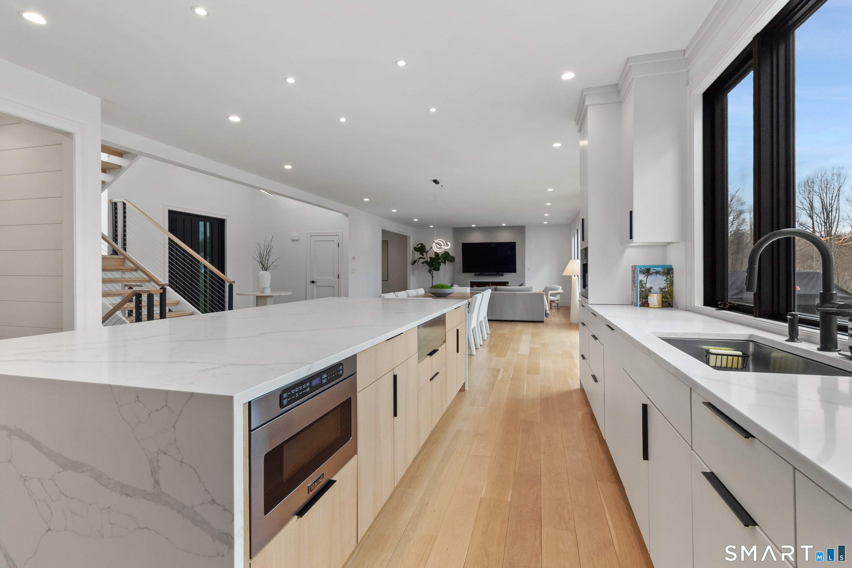 8 Holly Lane Newtown, CT 06482 - Photo 7 of 36 a large white kitchen with stainless steel appliances