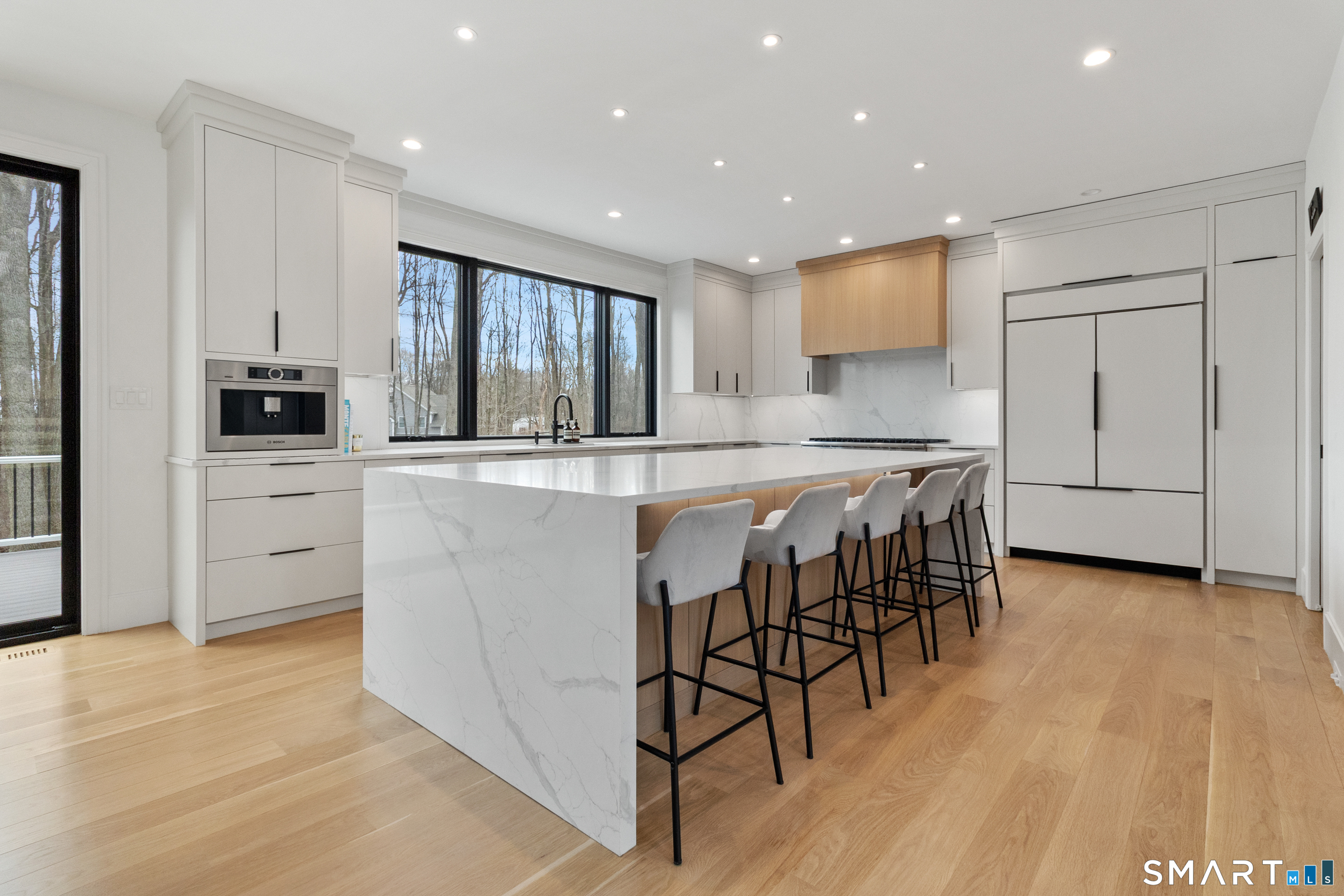 8 Holly Lane Newtown, CT 06482 - Photo 8 of 36 a large kitchen with cabinets table and chairs