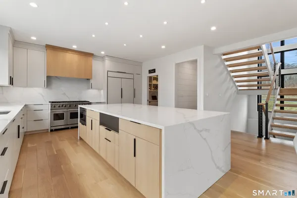 a view of kitchen with cabinets