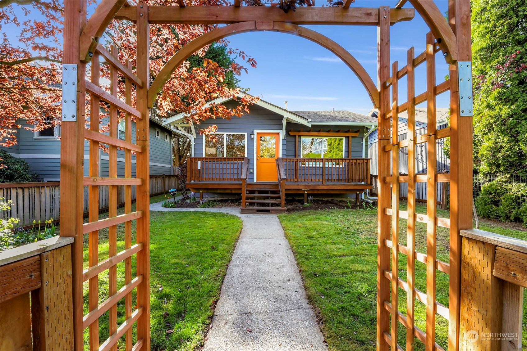 6023 44th Avenue Southwest Seattle, WA 98136 - Photo 2 of 32 a front view of a house with a yard