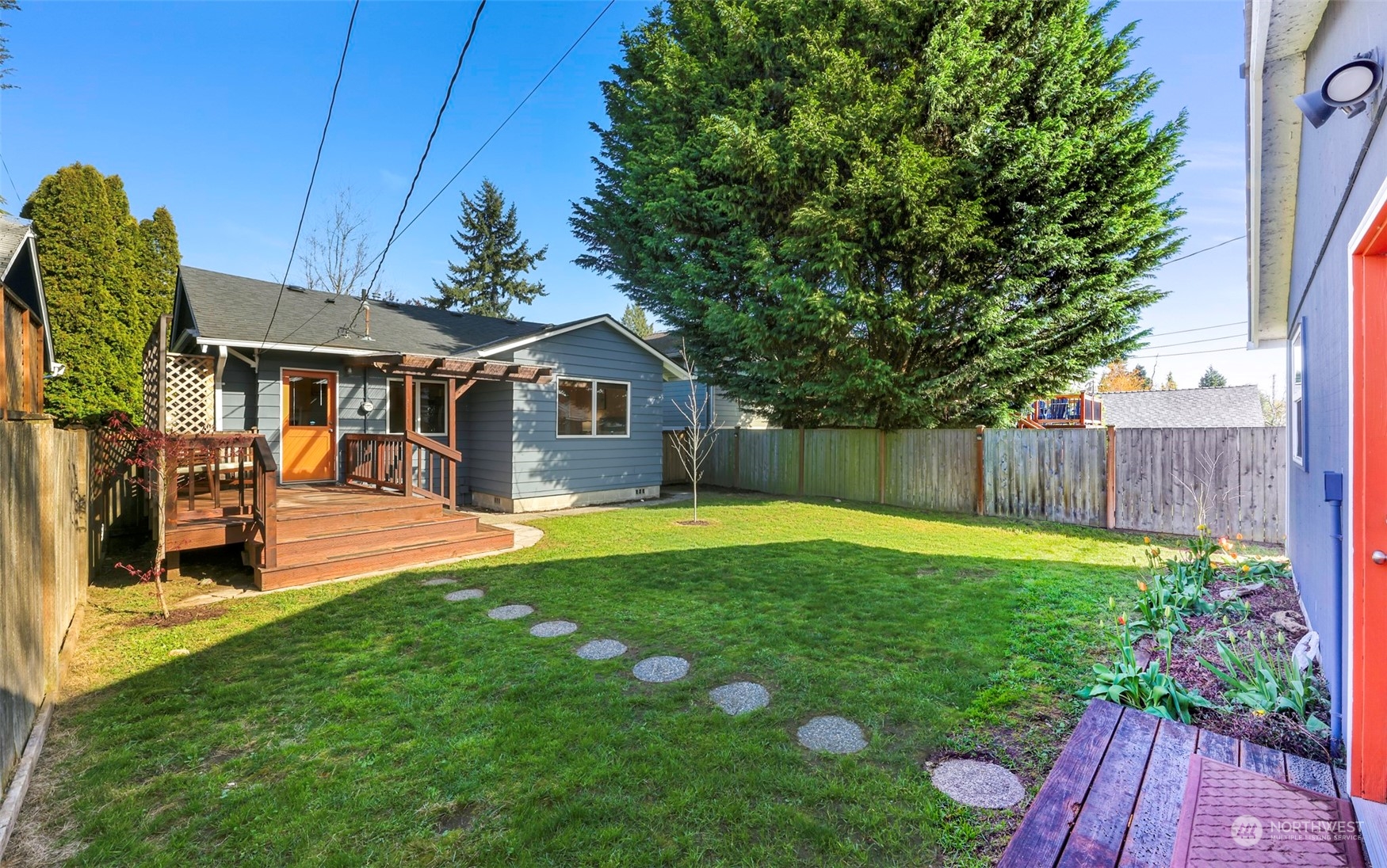 6023 44th Avenue Southwest Seattle, WA 98136 - Photo 24 of 32 a front view of a house with a yard