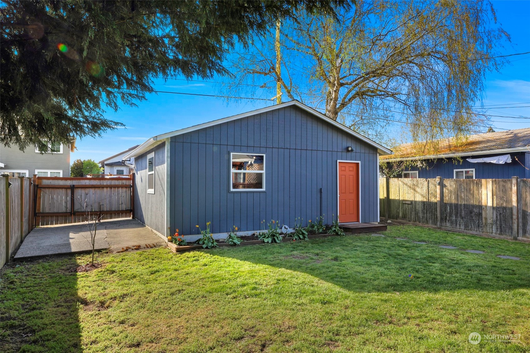 6023 44th Avenue Southwest Seattle, WA 98136 - Photo 27 of 32 a front view of house with yard and porch