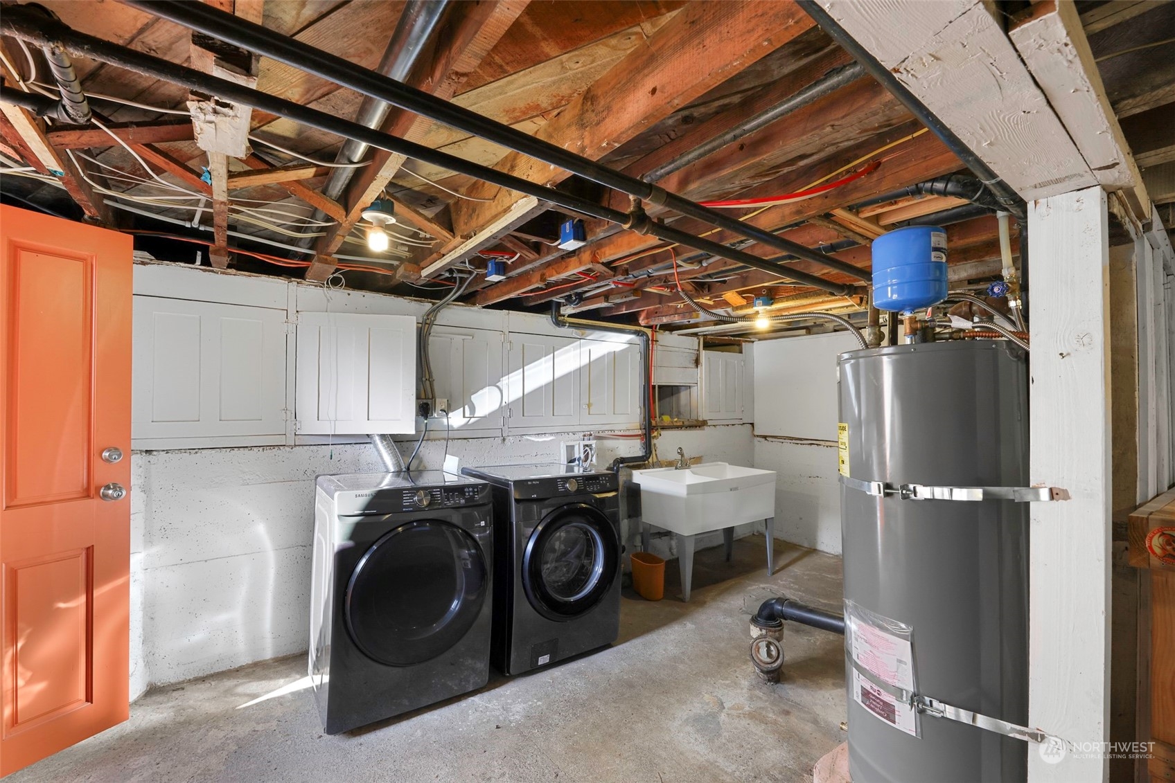 6023 44th Avenue Southwest Seattle, WA 98136 - Photo 31 of 32 a utility room with dryer and washer