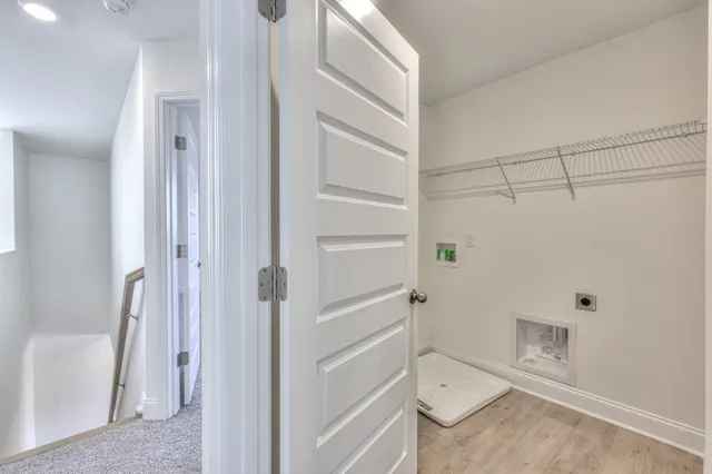 a bathroom with a shower and a glass door