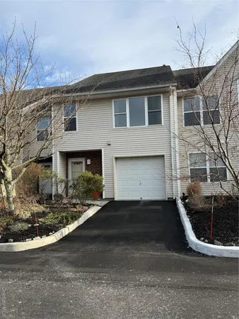 a view of a field with large trees