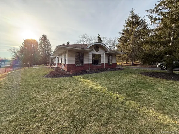 a view of a building with a backyard