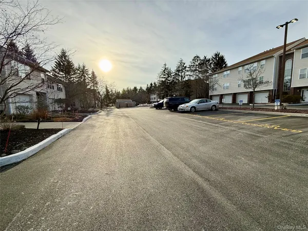 a view of a house with a snow on the road