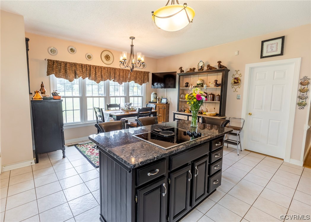 6373 Pine Slash Road Mechanicsville, VA 23116 - Photo 14 of 49 a kitchen with stainless steel appliances granite countertop a stove a refrigerator and a microwave