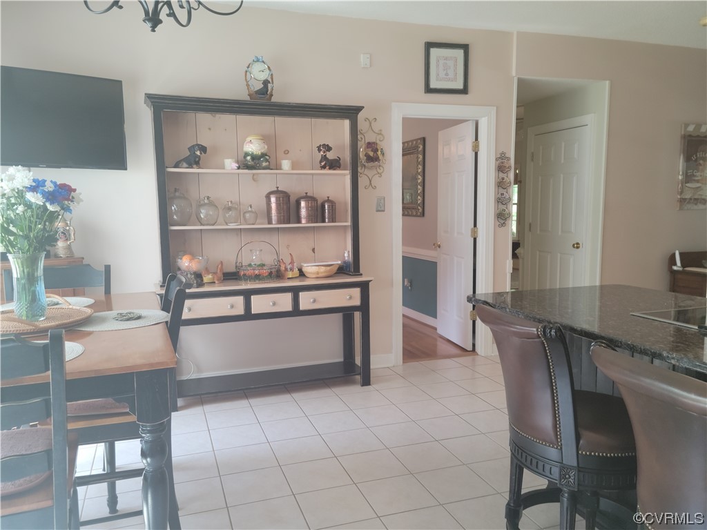 6373 Pine Slash Road Mechanicsville, VA 23116 - Photo 16 of 49 a living room with stainless steel appliances furniture a chandelier and a view of kitchen