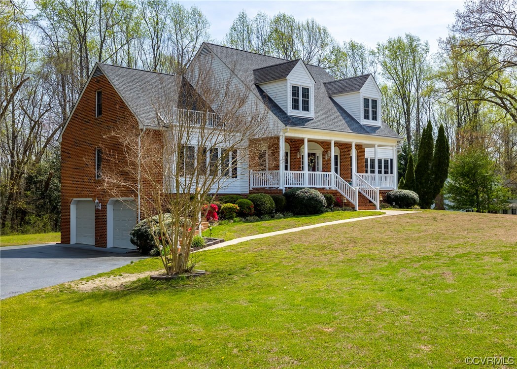 6373 Pine Slash Road Mechanicsville, VA 23116 - Photo 2 of 49 a view of a house with a yard and sitting area