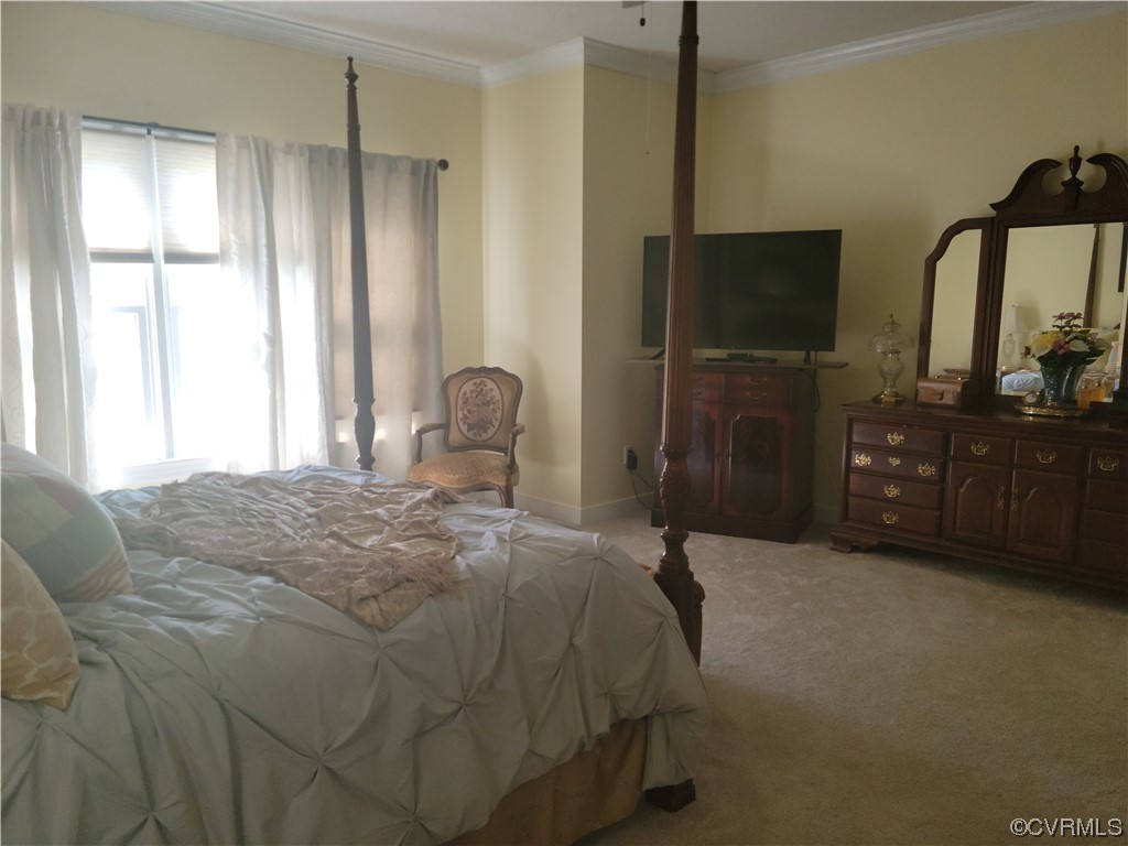 6373 Pine Slash Road Mechanicsville, VA 23116 - Photo 22 of 49 a bedroom with a bed and a flat tv screen on dresser
