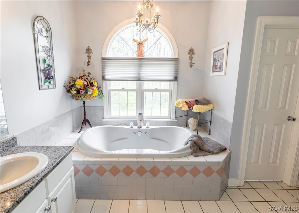 6373 Pine Slash Road Mechanicsville, VA 23116 - Photo 23 of 49 a bathroom with a sink mirror and window