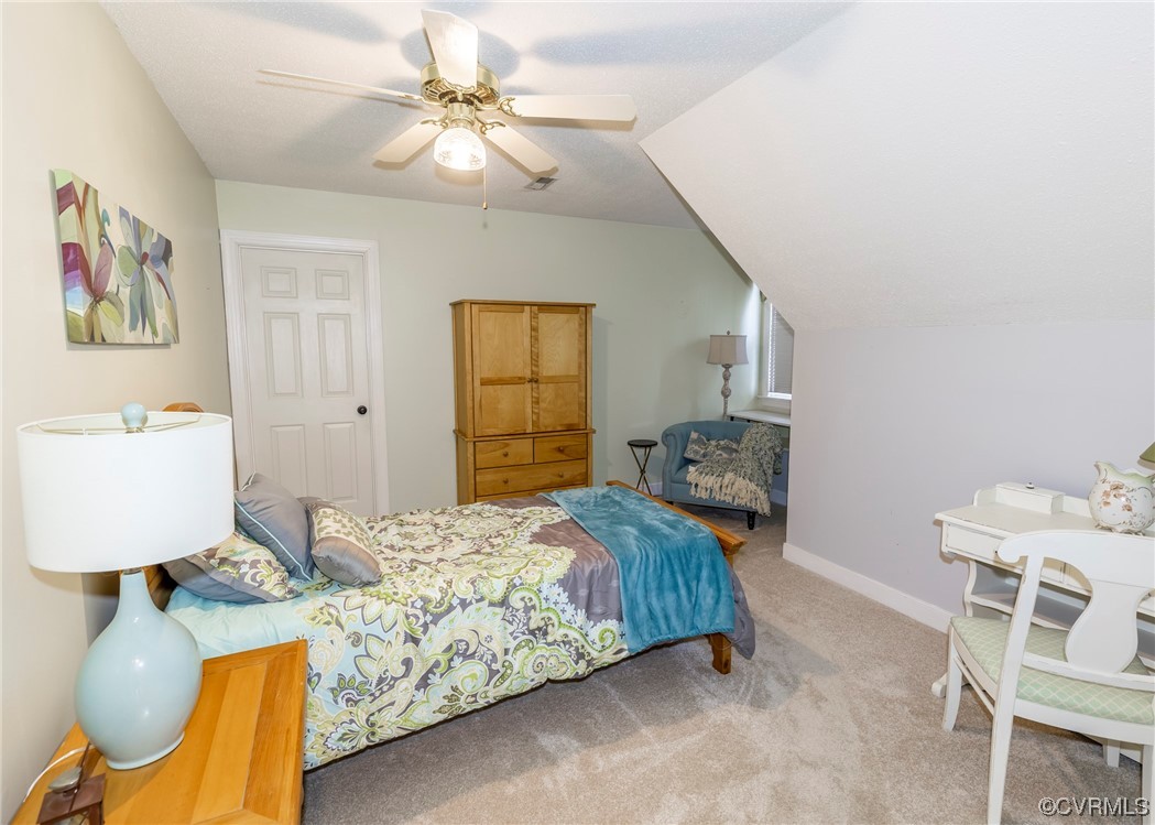 6373 Pine Slash Road Mechanicsville, VA 23116 - Photo 24 of 49 a bedroom with a bed and chair