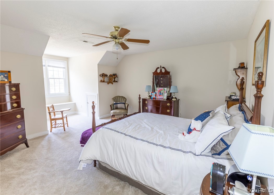 6373 Pine Slash Road Mechanicsville, VA 23116 - Photo 25 of 49 a bedroom with a bed and a chandelier