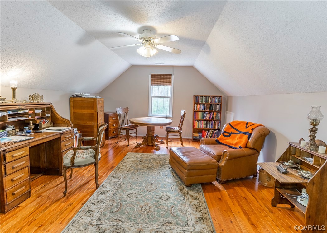 6373 Pine Slash Road Mechanicsville, VA 23116 - Photo 27 of 49 a living room with furniture a chandelier and a dining table